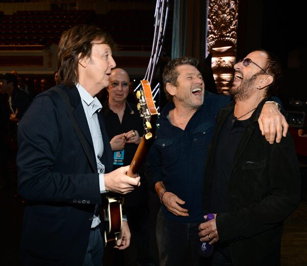 Jann Wenner [center] seen laughing with Paul McCartney [left] and Ringo Starr [right]